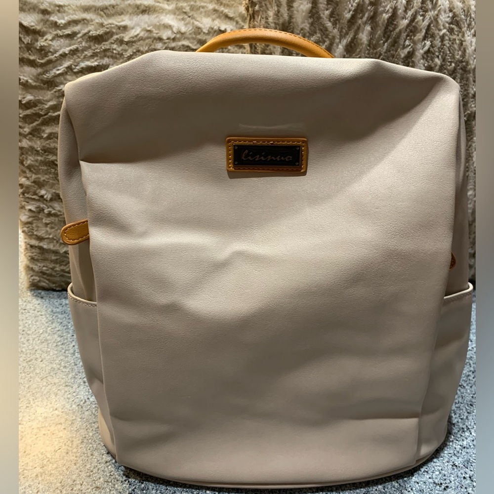 UHIW Backpack Bag is a Gray Color. It Measures 13 in. tall by 15 in. wide. New